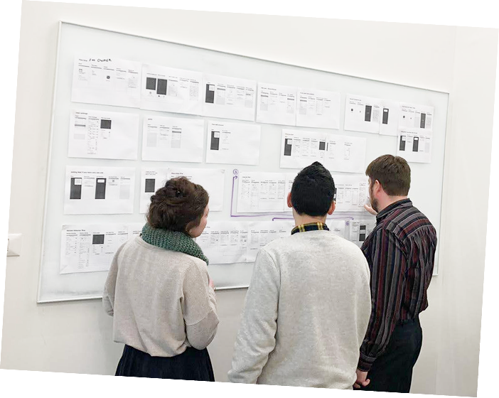 Design team reviewing high-fidelity wireframes