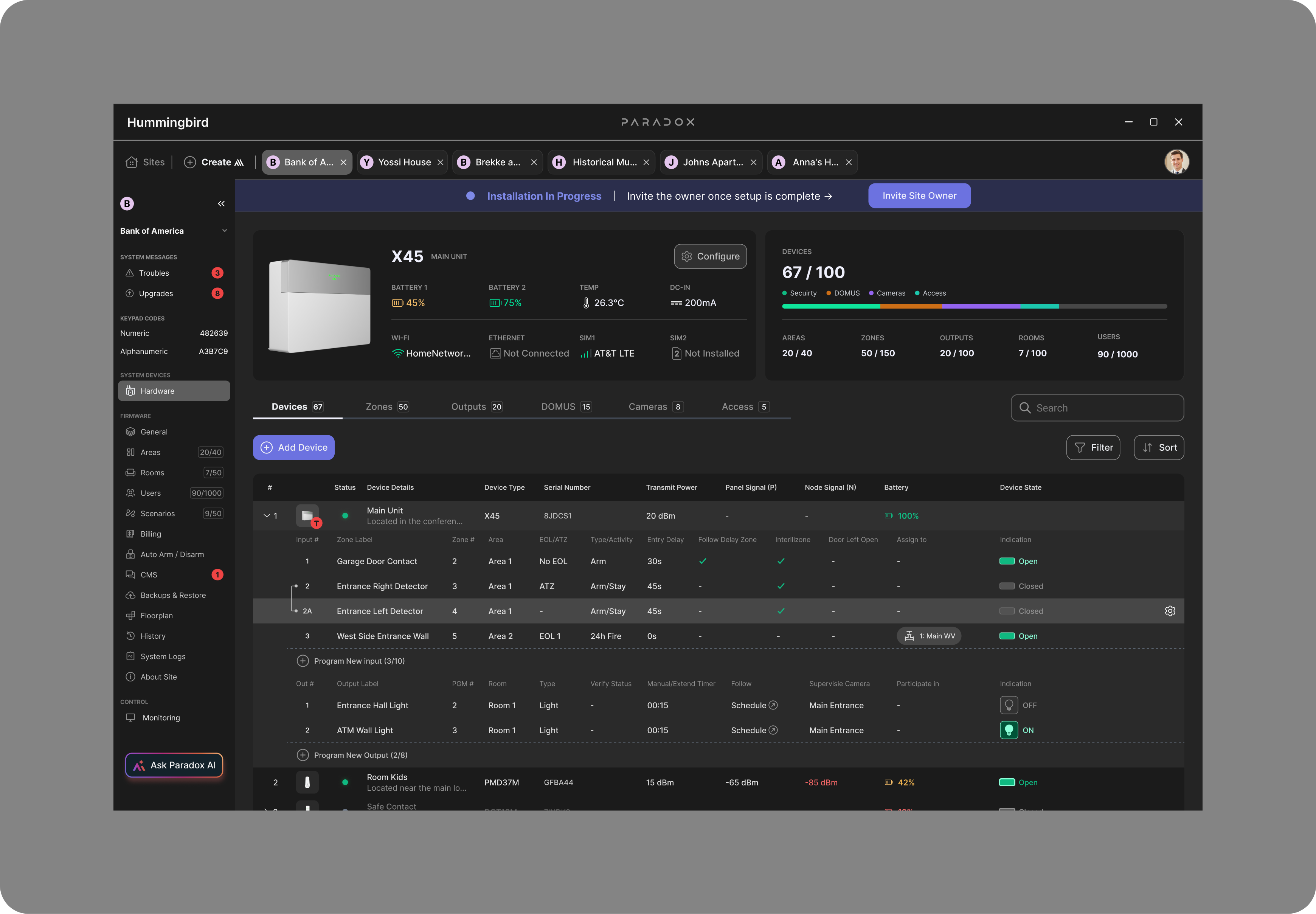 Final Hummingbird hardware workspace — X45 main-unit summary with live battery, temperature, DC-in and connectivity, a devices count with category breakdown, a devices table with expandable zones and outputs, and a Troubles and Upgrades sidebar